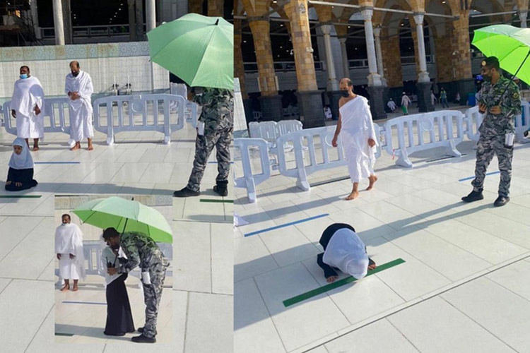 Saudi security guard holds umbrella for little girl praying under the sun at Grand Mosque