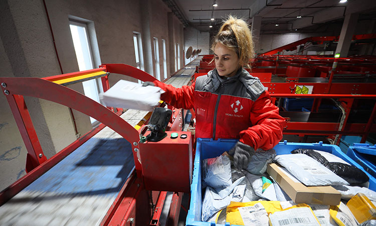 Postmen deliver goods on Ukraine's home front