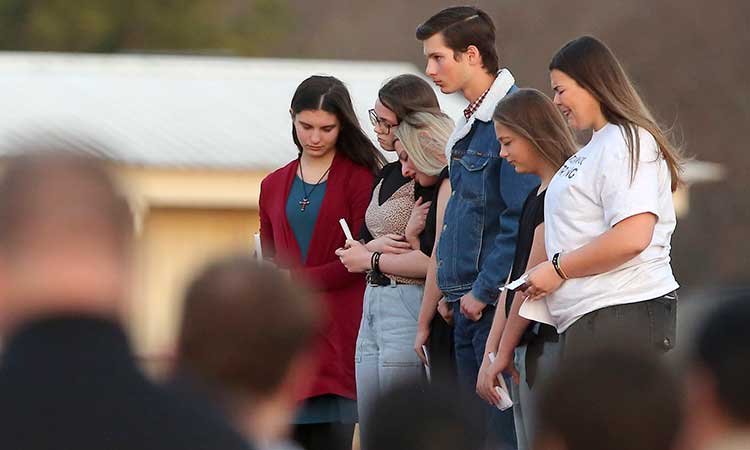 Mourners gather for a vigil for 6 girls killed in crash