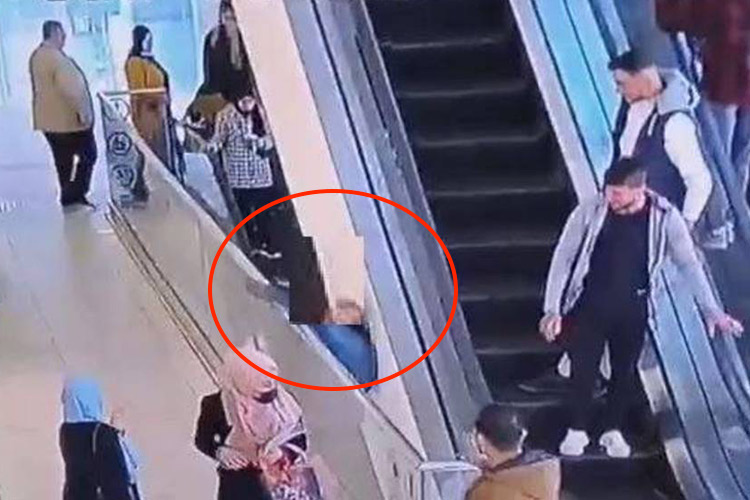 Jordanian man trying stunts falls off mall escalator