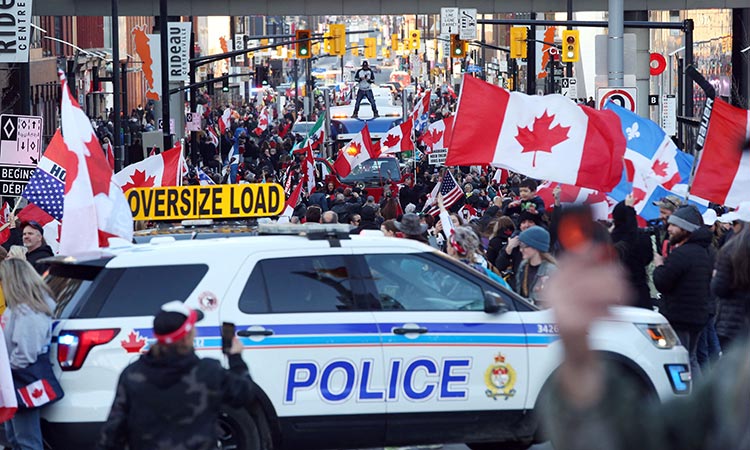 Police arrest several in Canadian capital as bikers parade turns unruly