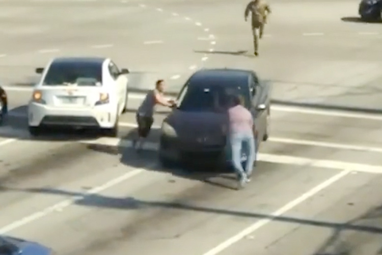 VIDEO: People stop moving car with their hands to save unconscious driver and avert accident