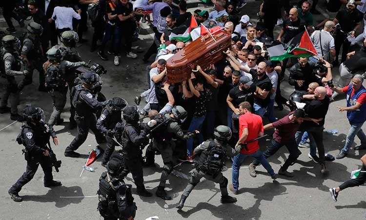 Israeli police beat pallbearers at journalist’s funeral