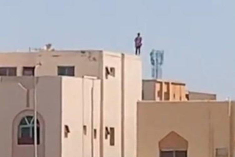 Saudi police prevent a woman from jumping off a building