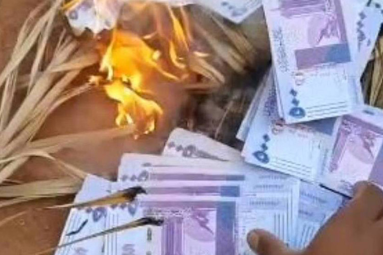 VIDEO: Sudanese man burns millions of pounds after falling victim to a massive fraud