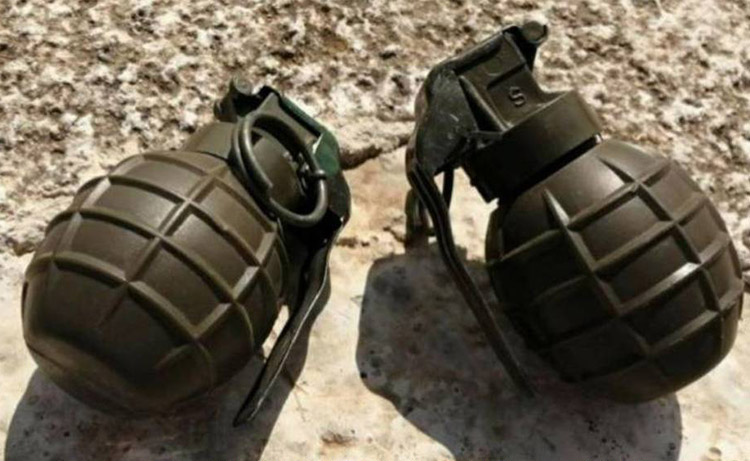 Angry husband throws a hand grenade at wife and children at home