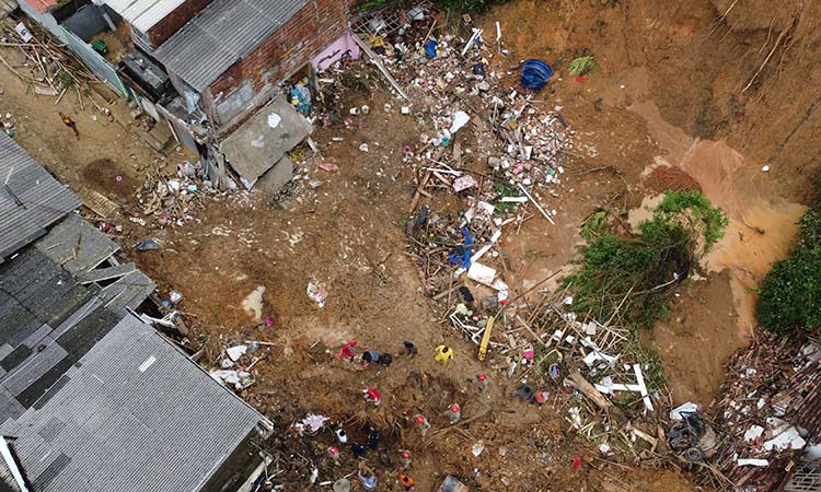 Death toll mounts from Brazil downpours as search continues