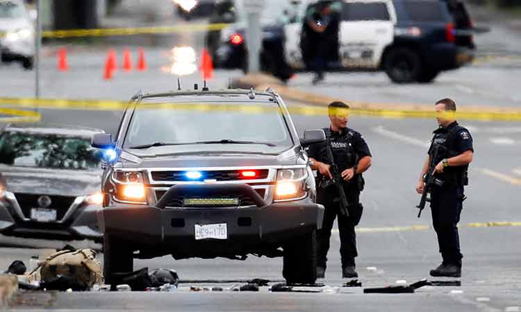 Two gunmen killed, six officers wounded in shootout at Canadian bank