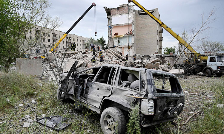 Death and destruction after Russian rockets hit apartment block in Ukraine