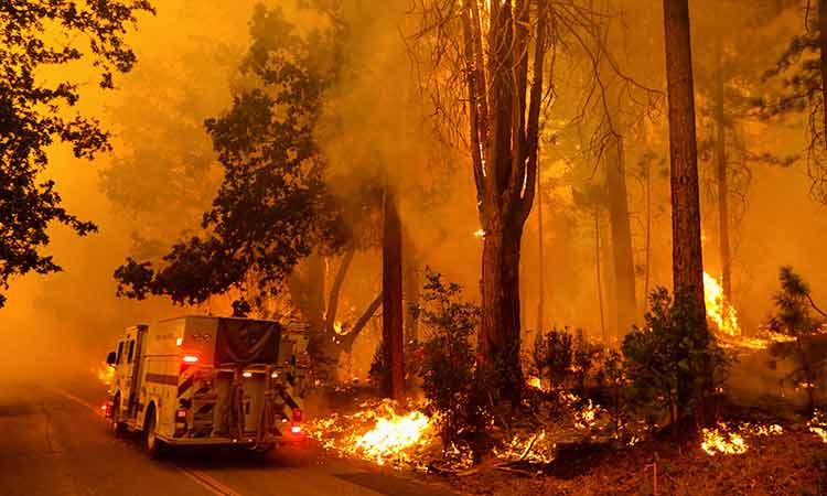 California wildfire rages on as US bakes in record-setting heat wave