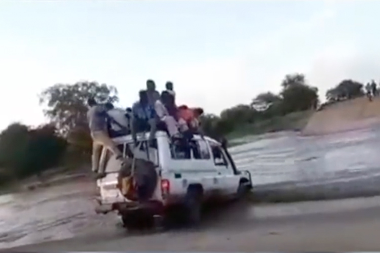 VIDEO: At least 10 dead as vehicle full of passengers drives into flooded valley in Sudan