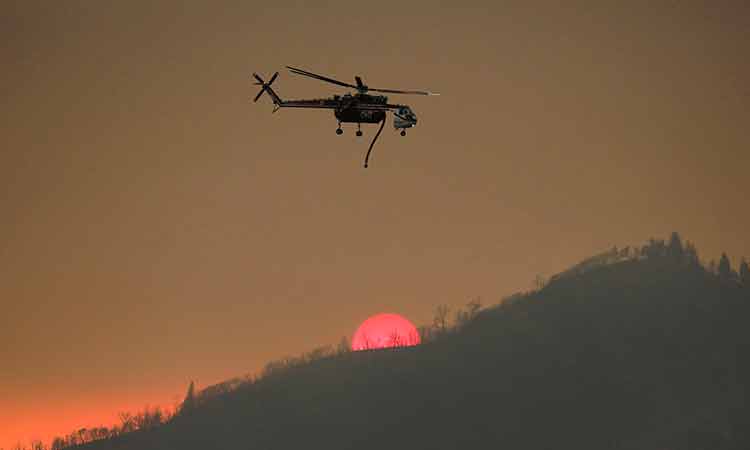 Firefighters tackle California wildfire as heat grips parts of US