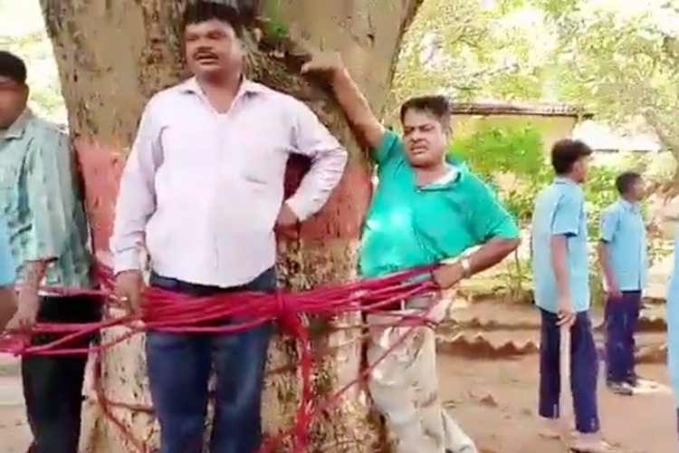 VIDEO: Students beat teacher and staff, tie them to a mango tree in India after failing in a subject 