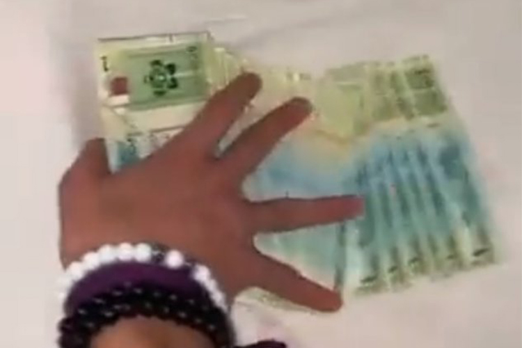 VIDEO: Qatar arrests two for showing off and insulting national currency