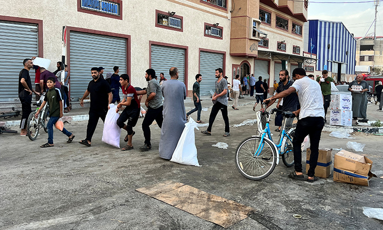 Thousands break into UN aid warehouses in Gaza for food, survival items