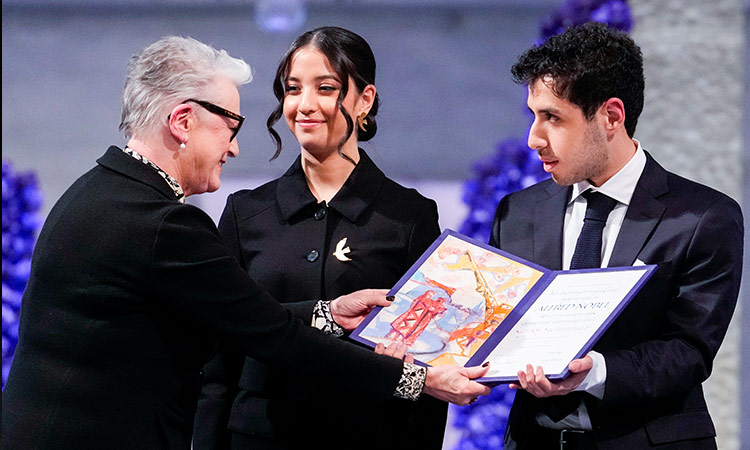 Children of jailed Iranian activist accept the Nobel Peace Prize on her behalf