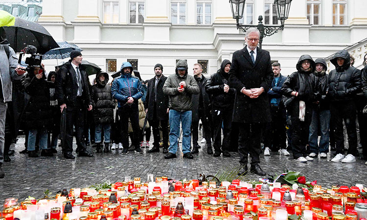 Czechs mourn victims of university shooting as police patrol public areas