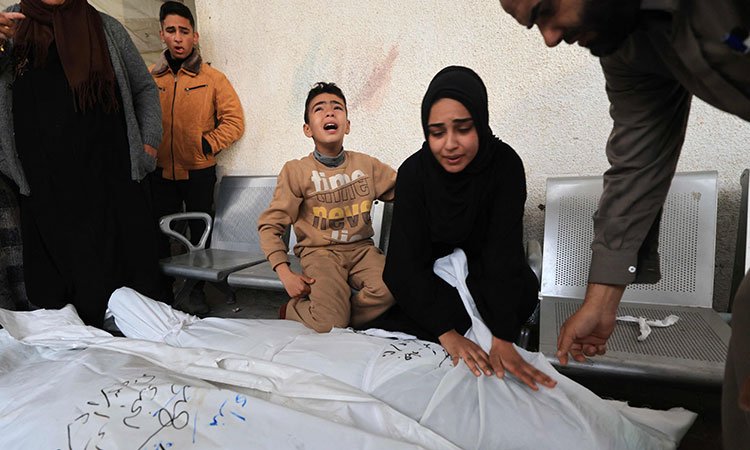 Israeli strike kills 76 members of one Gaza family, say rescue officials