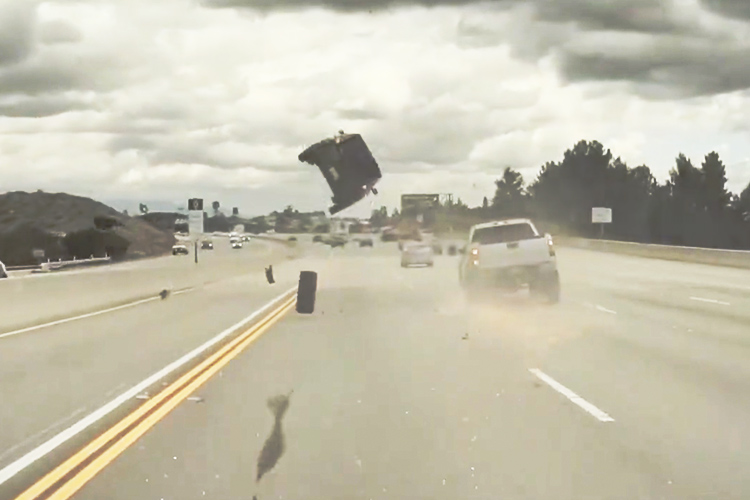 VIDEO: Car flies in the air after loose wheel from pickup truck hits it on California highway