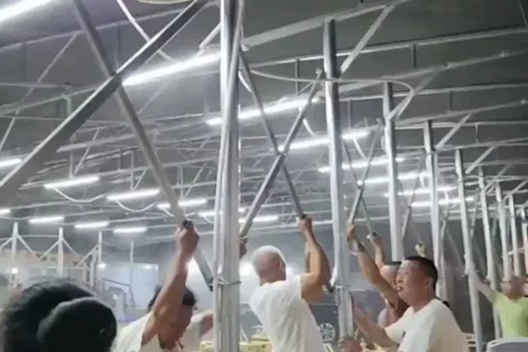 VIDEO: Chinese restaurant workers fly in the air after trying to hold down canopy in severe storm