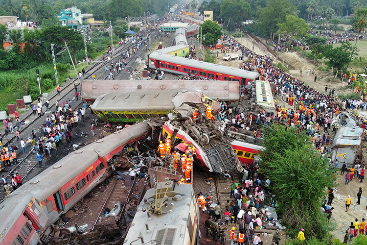 Father finds son alive in a morgue ‘under a pile of bodies’ after India train accident 