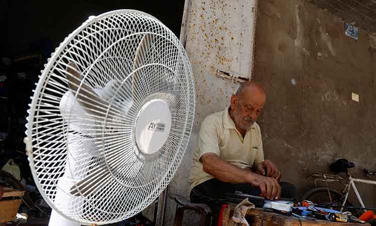 Gaza man repairing electric fans sees boom in business as heatwave fans demand