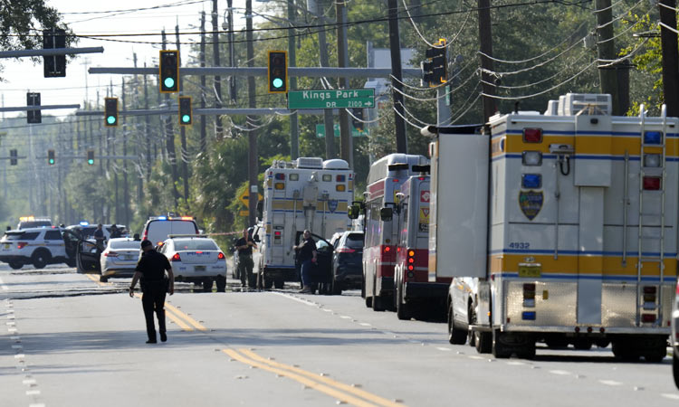 Gunman kills three, himself in racially motivated shooting