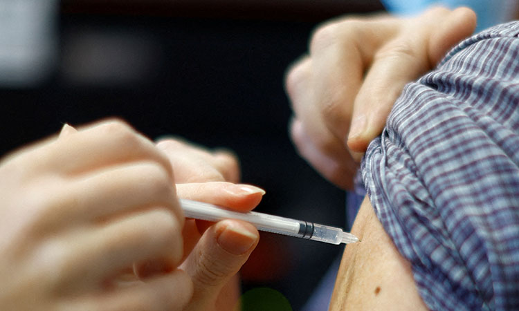 WHO sees 'incredibly low' COVID, flu vaccination rates as cases surge