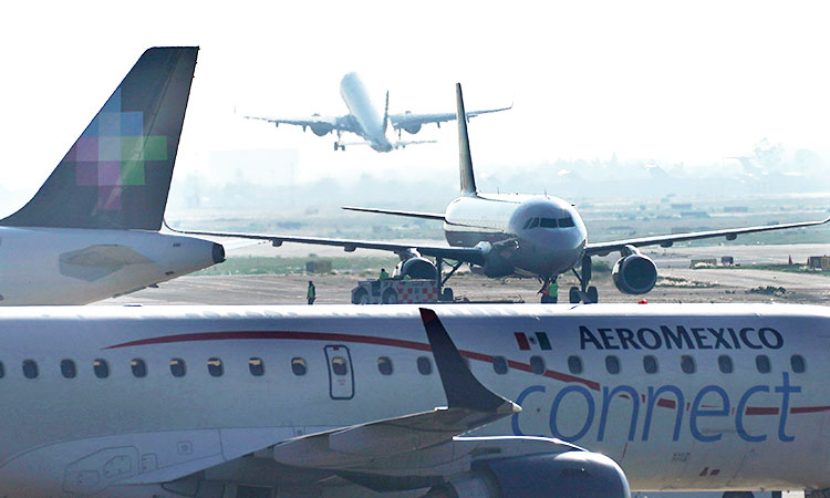 Passenger opens emergency exit, walks on plane’s wing