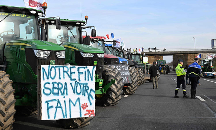 Angry farmers encircle Olympic host city Paris with tractor barricades