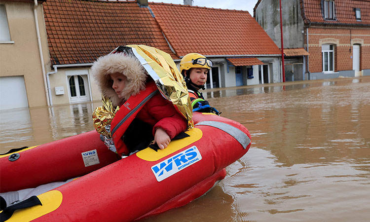 Extreme cold grips Nordic nations as floods hit western Europe