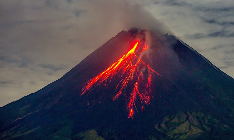 Indonesia volcano eruption kills 10, sets houses aflame