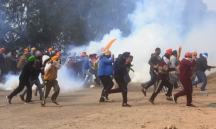 Indian police fire tear gas as protesting farmers march to capital