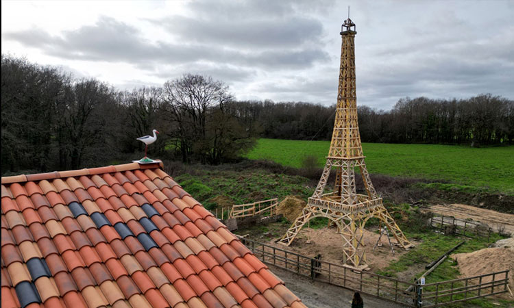 Two friends build Eiffel Tower from recycled wood