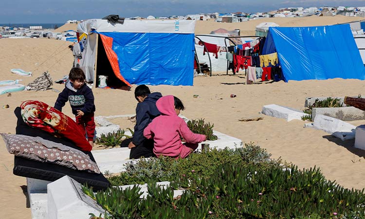 ‘We are living among the dead,’ Gaza families seek shelter in cemetery