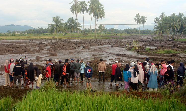 12 dead after Indonesia flash floods, cold lava flow