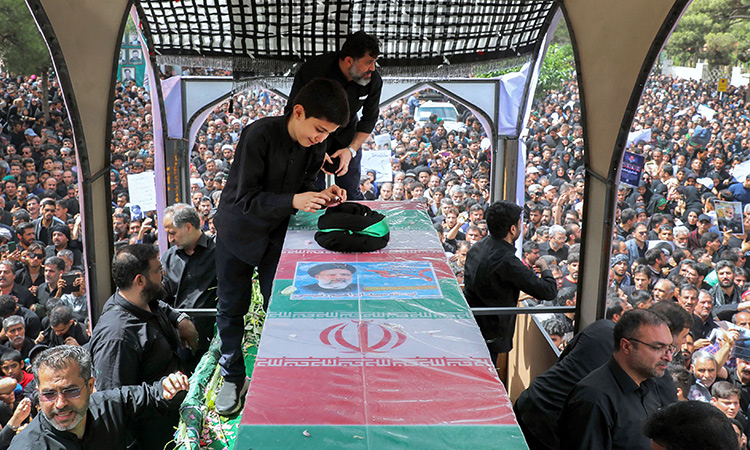 President Raisi buried as thousands of mourners pack Iranian city of Mashhad