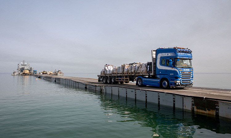 Aid trucks begin entering Gaza under pact with Egypt to bypass Rafah