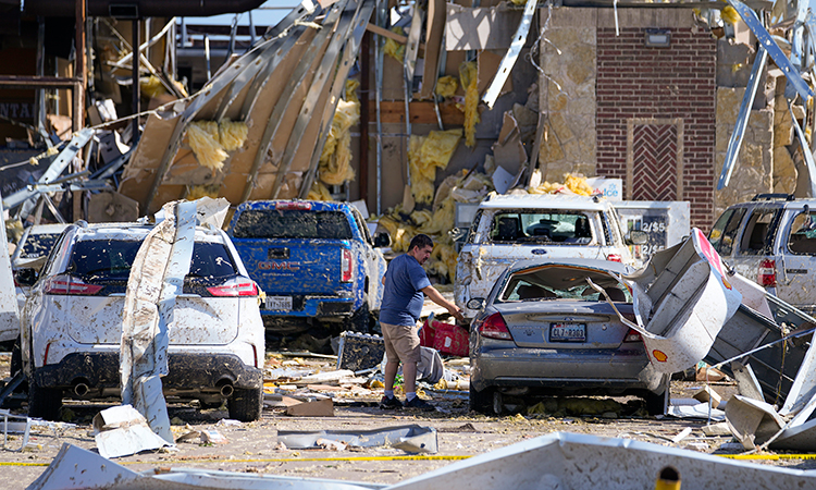 At least 18 dead in US tornadoes, storms