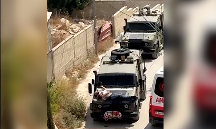 VIDEO: Israeli forces tie wounded Palestinian to jeep in West Bank raid