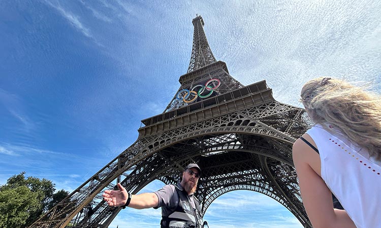 Police arrest a man climbing the Eiffel Tower hours before Olympic closing ceremony