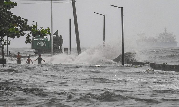 Storm sets off floods and landslides in Philippines, leaving at least 14 dead 