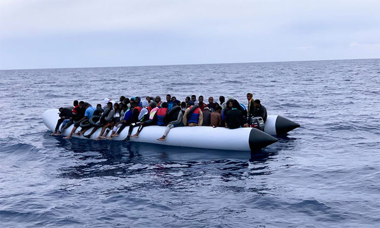 Why are migrants in boats a heated issue?