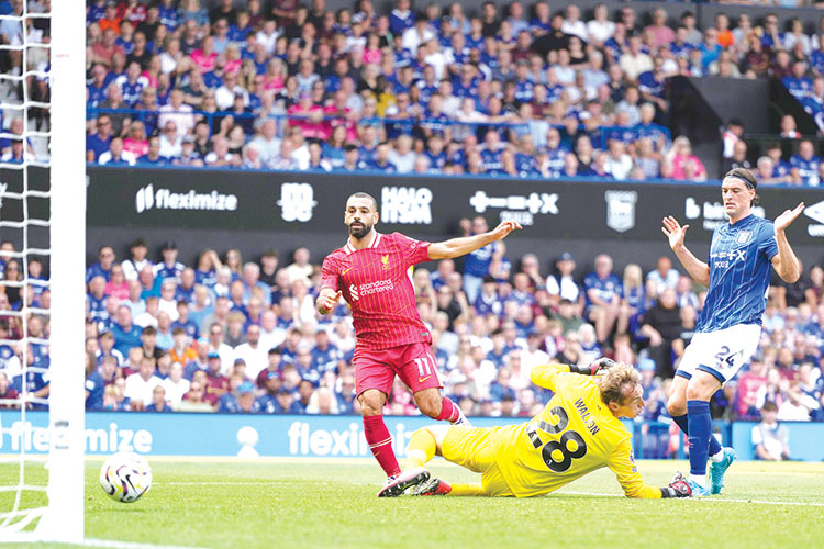 Liverpool begin Slot era with win at Ipswich, Arsenal down Wolves