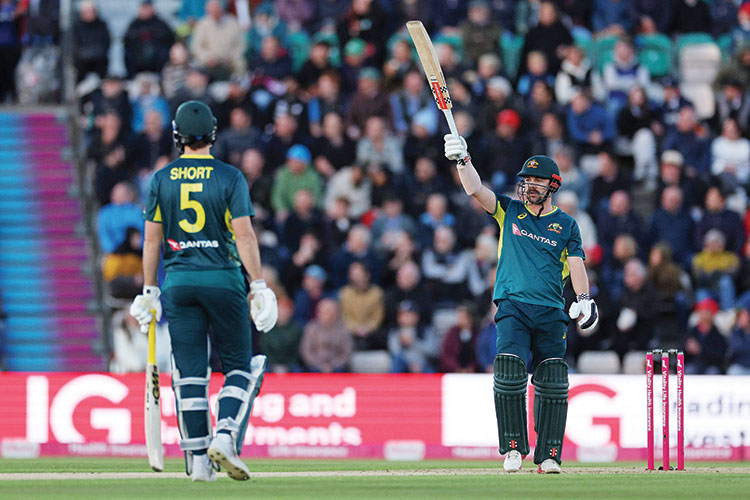 Head and Zampa   star as Australia   beat England in   T20 opener to   take series lead